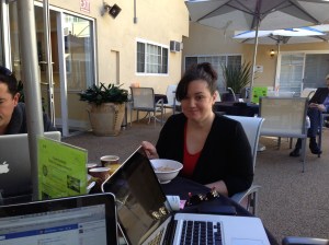 Tamar preparing her lecture by the pool